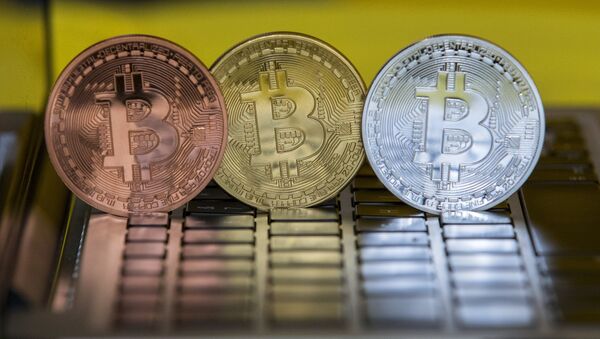 A picture taken on February 6, 2018 shows a visual representation of the digital crypto-currency Bitcoin, at the Bitcoin Change shop in the Israeli city of Tel Aviv - Sputnik International