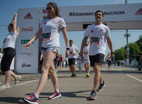 American-born Russian snowboarder, two-time Olympic champion of the year 2014 Vic Ivan Wild and Russian snowboarder, Olympic bronze medalist and World Cup stage medalist Alyona Zavarzina during the charity race Running Hearts. (File) American-born Russian snowboarder, two-time Olympic champion of the year 2014 Vic Ivan Wild and Russian snowboarder, Olympic bronze medalist and World Cup stage medalist Alyona Zavarzina during the charity race Running Hearts. (File) - Sputnik International