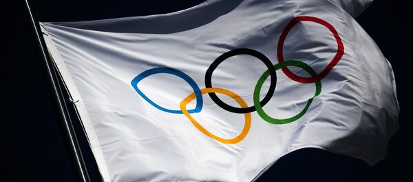 The Olympic flag flutters above the medals plaza at the Hwaenge Olympic Park in Pyeongchang, the Republic of Korea where winners of the 2018 Winter Olympics will be awarded - Sputnik International