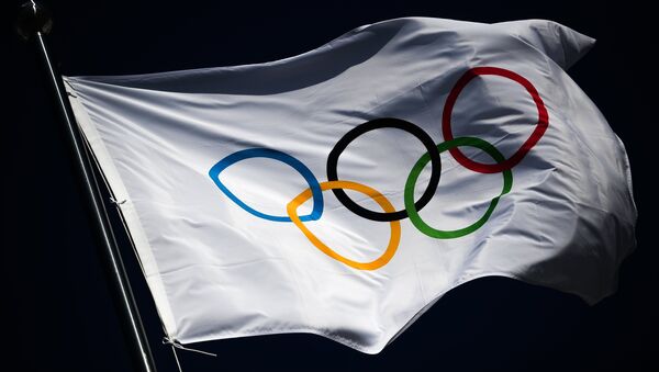 The Olympic flag flutters above the medals plaza at the Hwaenge Olympic Park in Pyeongchang, the Republic of Korea where winners of the 2018 Winter Olympics will be awarded - Sputnik International