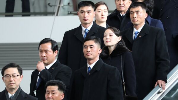 Kim Yo Jong, the younger sister of North Korean leader Kim Jong Un, is escorted by South Korean security guards at the Incheon International Airport, in Incheon, South Korea February 9, 2018 - Sputnik International