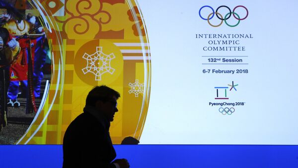 A member of the International Olympic Committee walks past a display during the 132nd IOC Session prior to the 2018 Winter Olympics in Pyeongchang, South Korea, Wednesday, Feb. 7, 2018 - Sputnik International