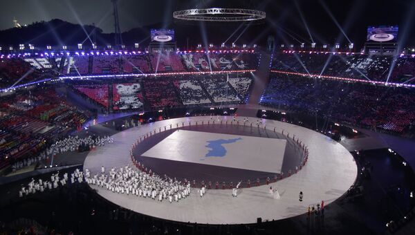 Athletes from North and South Korea wave Korean unification flags as they walk on stage during the opening ceremony of the 2018 Winter Olympics in Pyeongchang, South Korea, Friday, Feb. 9, 2018 Athletes from North and South Korea wave Korean unification flags as they walk on stage during the opening ceremony of the 2018 Winter Olympics in Pyeongchang, South Korea, Friday, Feb. 9, 2018 - Sputnik International