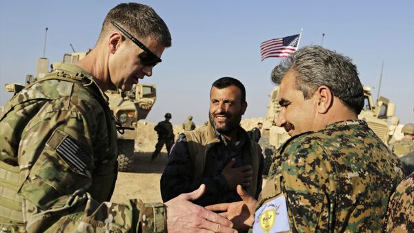 U.S. Army Maj. Gen. Jamie Jarrard left, thanks Manbij Military Council commander Muhammed Abu Adeel during a visit to a small outpost near the town of Manbij, northern Syria, Wednesday, Feb. 7, 2018 - Sputnik International