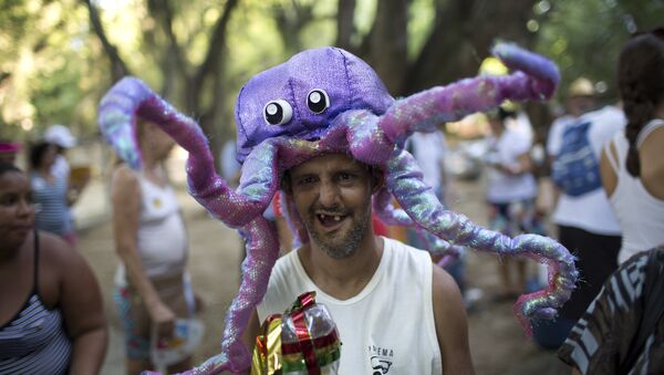 A patient from the Nise da Silveira Mental Health Institute wears an octopus costume during the institute's carnival parade, coined in Portuguese: Loucura Suburbana, or Suburban Madness, in the streets of Rio de Janeiro, Brazil, Thursday, Feb. 23, 2017 - Sputnik International
