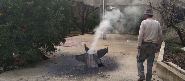 A Lebanese farmer inspects a missile, which according to the Lebanon national news agency is part of a Syrian air defense missile targeting an Israeli warplane A Lebanese farmer inspects a missile, which according to the Lebanon national news agency is part of a Syrian air defense missile targeting an Israeli warplane - Sputnik International
