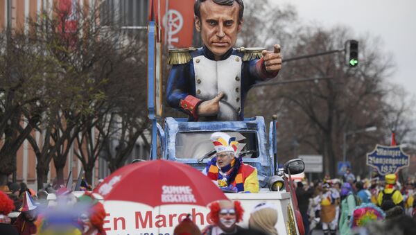 A carnival float depicting France's president Emmanuel Macron is part of the Rose Monday parade in Mainz, Germany - Sputnik International