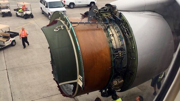 This photo provided by passenger Haley Ebert shows damage to an engine on what the FAA says is a Boeing 777 after parts came off the jetliner during its flight from San Francisco to Honolulu Tuesday, Feb. 13, 2018 - Sputnik International