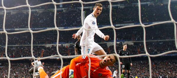 Soccer Football - Champions League Round of 16 First Leg - Real Madrid vs Paris St Germain - Santiago Bernabeu, Madrid, Spain - February 14, 2018 Real Madrid’s Cristiano Ronaldo celebrates after Marcelo scores their third goal as Paris Saint-Germain’s Alphonse Areola looks dejected Soccer Football - Champions League Round of 16 First Leg - Real Madrid vs Paris St Germain - Santiago Bernabeu, Madrid, Spain - February 14, 2018 Real Madrid’s Cristiano Ronaldo celebrates after Marcelo scores their third goal as Paris Saint-Germain’s Alphonse Areola looks dejected - Sputnik International
