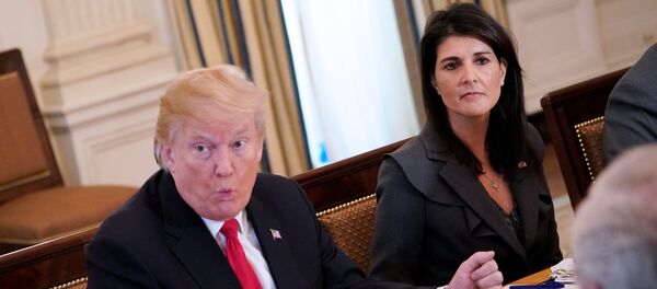 US President Donald Trump (C) speaks, watched by US Ambassador to the UN Nikki Haley, during lunch with members of the United Nations Security Council in the State Dining Room of the White House in Washington, DC - Sputnik International