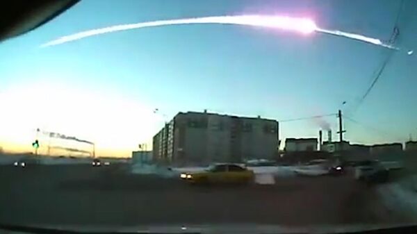 The trace of a flying object in the sky over Chelyabinsk (still from a dashboard camera). (File) - Sputnik International