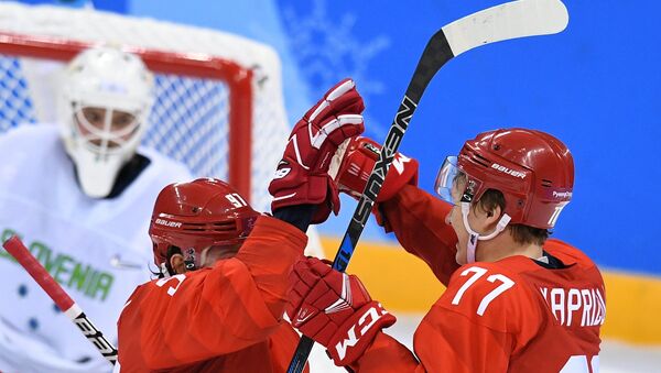 From left: Nikita Gusev (Russia) and Kirill Kaprizov (Russia) celebrate a goal during a group stage match between Russia and Slovenia in the men’s ice hockey tournament, at the XXIII Olympic Winter Games in Pyeongchang - Sputnik International