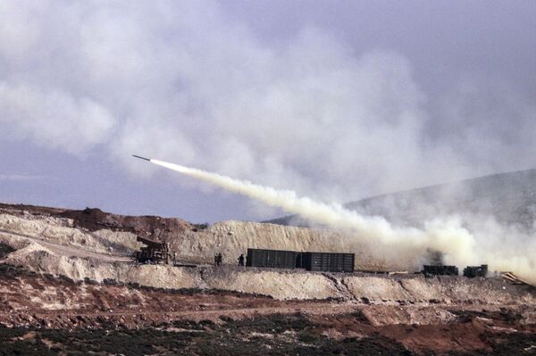 Turkish artillery fires toward Syrian Kurdish positions in Afrin area, Syria, from Turkish side of the border in Hatay, Turkey, Friday, Feb. 9, 2018 Turkish artillery fires toward Syrian Kurdish positions in Afrin area, Syria, from Turkish side of the border in Hatay, Turkey, Friday, Feb. 9, 2018 - Sputnik International