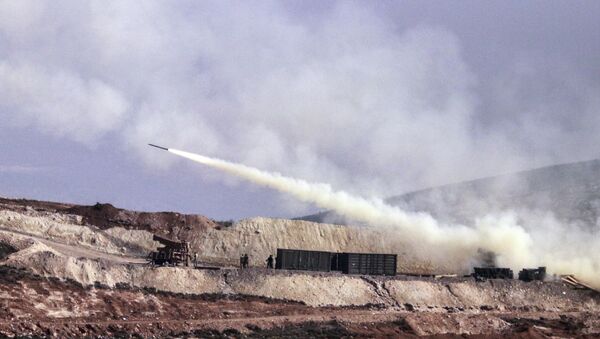 Turkish artillery fires toward Syrian Kurdish positions in Afrin area, Syria, from Turkish side of the border in Hatay, Turkey, Friday, Feb. 9, 2018 - Sputnik International
