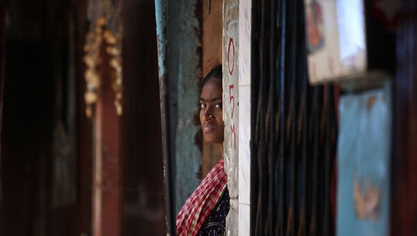 An Indian sex worker looks on outside her house at the Kamathipura red-light district, in Mumbai, India, Monday (File) - Sputnik International