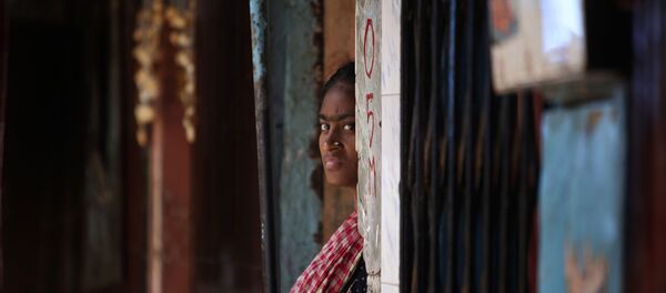 An Indian sex worker looks on outside her house at the Kamathipura red-light district, in Mumbai, India, Monday (File) - Sputnik International