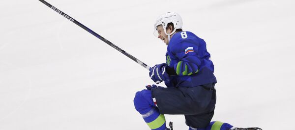 Ice Hockey - Pyeongchang 2018 Winter Olympics - Men's Preliminary Round Match - Slovenia v Slovakia - Kwandong Hockey Centre, Gangneung, South Korea - February 17, 2018 - Ziga Jeglic of Slovenia celebrates after scoring the winning goal in a penalty shoot-out against Slovakia. - Sputnik International