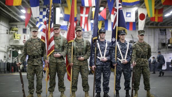 A flag party of U.S. Marines and Navy personnel take part in a ceremony marking the start of Talisman Saber 2017, a biennial joint military exercise between the United States and Australia, aboard the USS Bonhomme Richard amphibious assault ship on the the Pacific Ocean off the coast of Sydney Thursday, June 29, 2017 - Sputnik International