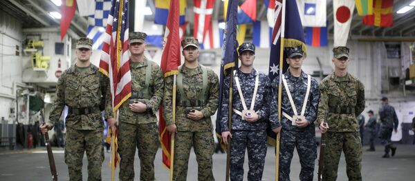 A flag party of U.S. Marines and Navy personnel take part in a ceremony marking the start of Talisman Saber 2017, a biennial joint military exercise between the United States and Australia, aboard the USS Bonhomme Richard amphibious assault ship on the the Pacific Ocean off the coast of Sydney Thursday, June 29, 2017 - Sputnik International