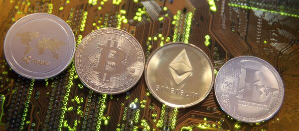 Representations of the Ripple, Bitcoin, Etherum and Litecoin virtual currencies are seen on a PC motherboard in this illustration picture, February 13, 2018. Picture is taken February 13, 2018 - Sputnik International