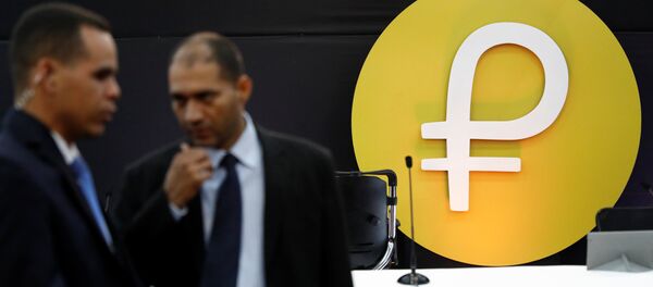 The new Venezuelan cryptocurrency Petro logo is seen during its launching in Caracas, Venezuela February 20, 2018 The new Venezuelan cryptocurrency Petro logo is seen during its launching in Caracas, Venezuela February 20, 2018 - Sputnik International