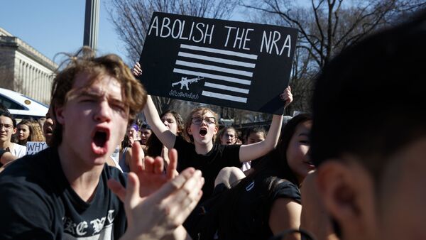 Sydney Acuff, 16, of Silver Spring, Md., center, screams during a student protest for gun control legislation in front of the White House, Wednesday, Feb. 21, 2018, in Washington. - Sputnik International