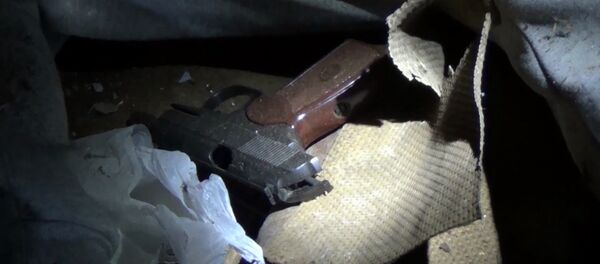 A Makarov gun at the Nizhny Novgorod location where a suspected terrorist who was planning an act of terror on the day of the presidential election was neutralized by the Federal Security Service (FSB) personnel - Sputnik International