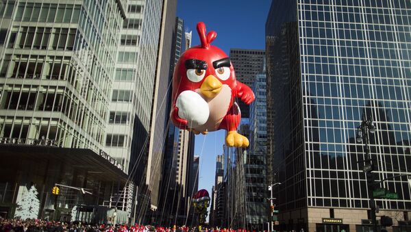 A balloon of Red, from Angry Birds floats down Sixth Avenue during the Macy's Thanksgiving Day Parade in New York, Thursday, Nov. 23, 2017 - Sputnik International