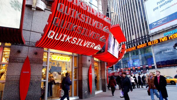 People walk by the new Quiksilver store in New York's Times Square. (File) - Sputnik International