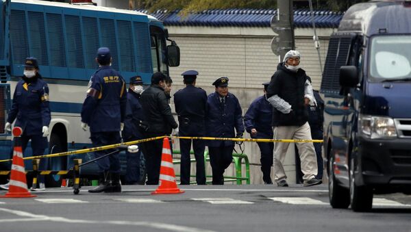 Police officers are seen in front of the headquarters of the General Association of Korean Residents in Japan (Chongryon), after police arrested two men suspected of shooting in to the building in Tokyo, Japan, February 23, 2018 - Sputnik International
