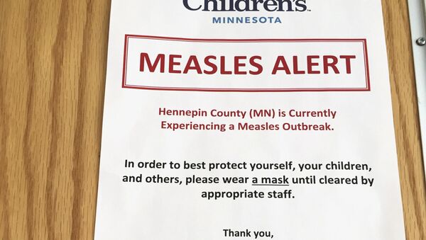 (File) In this Tuesday, May 2, 2017 photo, a sign at the specialty clinic at Children's Minnesota in Minneapolis, alerts patients to a measles outbreak in the area - Sputnik International