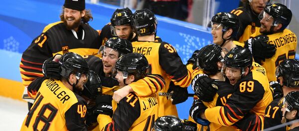 Germany's team members celebrate their victory in the semifinals between the Canada and Germany national teams in the men’s ice hockey tournament, at the XXIII Olympic Winter Games Germany's team members celebrate their victory in the semifinals between the Canada and Germany national teams in the men’s ice hockey tournament, at the XXIII Olympic Winter Games - Sputnik International