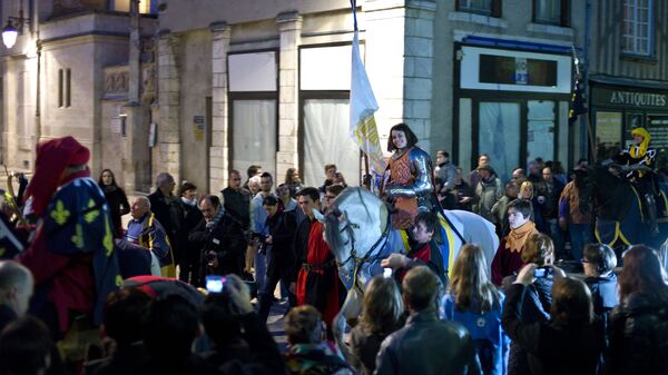 Pauline Finet performs as Joan of Arc during the opening ceremony of the 600th anniversary of the birth of Joan of Arc, in Orleans, central France. File photo - Sputnik International
