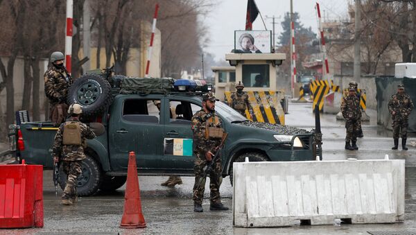 Afghan security forces keep watch at a check point near the site of a suicide attack in Kabul, Afghanistan February 24, 2018 - Sputnik International