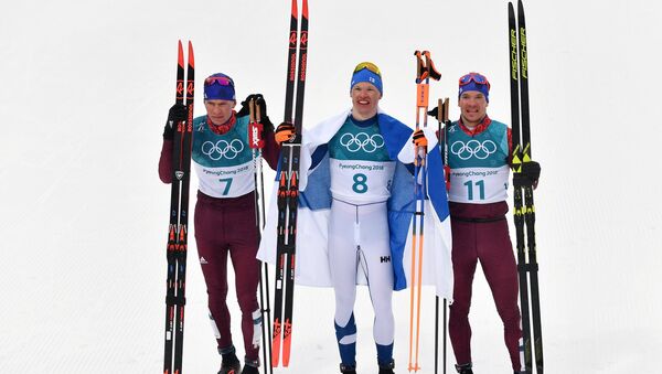 Medalists in the 50-km mass start race in men’s cross-country skiing at the XXIII Olympic Winter Games in Pyeongchang, from left: Alexander Bolshunov (Russia) - silver medal; Iivo Niskanen (Finland) - gold medal; and Andrei Larkov (Russia) - bronze medal - Sputnik International
