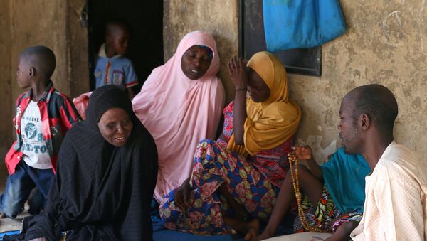 Relatives of missing school girls react in Dapchi in the northeastern state of Yobe, after an attack on the village by Boko Haram, Nigeria February 23, 2018 - Sputnik International