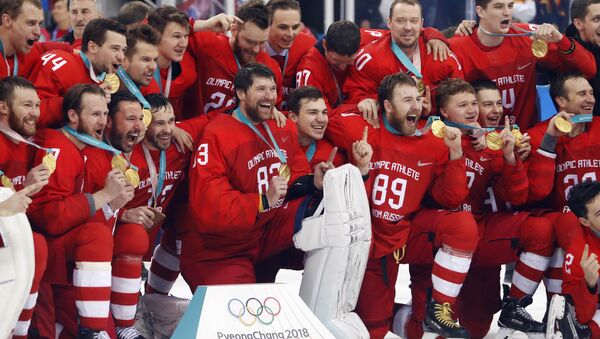 Ice Hockey - Pyeongchang 2018 Winter Olympics - Men's Final Match - Russia - Germany - Gangneung Hockey Centre, Gangneung, South Korea - February 25, 2018 - Russian team reacts with their gold medals - Sputnik International