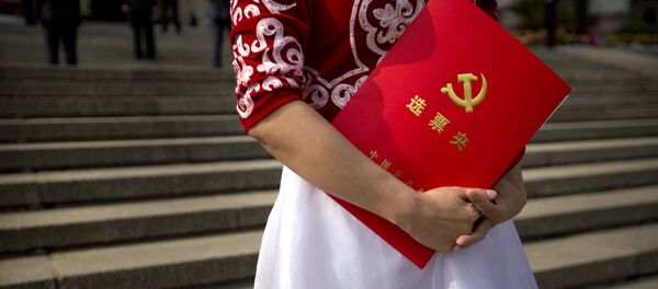 A delegate holds her ballot folder after the closing ceremony of China's 19th Party Congress at the Great Hall of the People in Beijing, Tuesday, Oct. 24, 2017 A delegate holds her ballot folder after the closing ceremony of China's 19th Party Congress at the Great Hall of the People in Beijing, Tuesday, Oct. 24, 2017 - Sputnik International