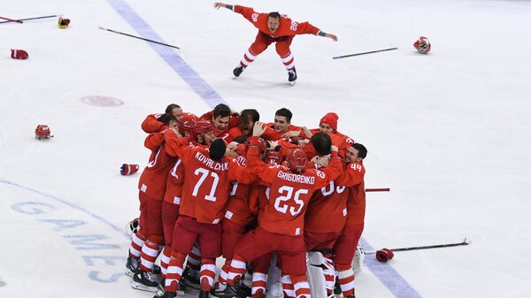 Russian ice hockey players celebrating their victory in the final match between Russia and Germany in the men's ice hockey tournament at the 2018 Winter Olympics - Sputnik International