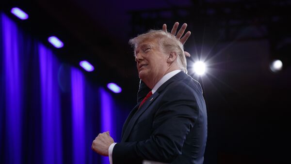 President Donald Trump gestures as he makes a joke about his hair during remarks to the Conservative Political Action Conference, Friday, Feb. 23, 2018, in Oxon Hill, Md. - Sputnik International