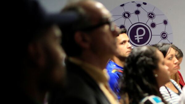 The new Venezuelan cryptocurrency Petro logo is seen at a facility of the Youth and Sports Ministry in Caracas, Venezuela February 23, 2018 - Sputnik International