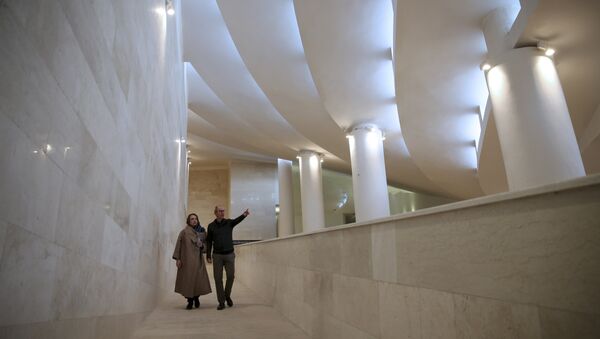 In this Wednesday, Feb. 7, 2018, photo, Reza Daneshmir, right, gestures as he talks with his wife Catherine Spiridonoff, both architects of Vali-e-Asr mosque, while they walk on one of the mosque's ramps, in Tehran, Iran - Sputnik International