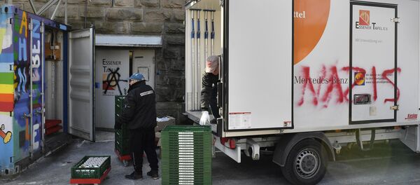 Helpers unload a truck of the food bank Tafel in Essen, western Germany, Tuesday, Feb. 27, 2018 Helpers unload a truck of the food bank Tafel in Essen, western Germany, Tuesday, Feb. 27, 2018 - Sputnik International