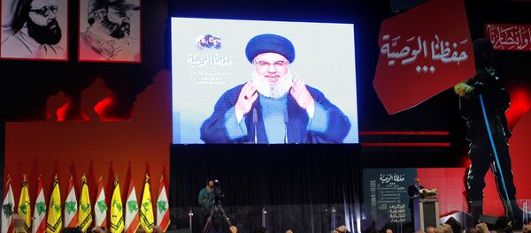 Lebanon's Hezbollah leader Sayyed Hassan Nasrallah is seen on a video screen as he addresses his supporters in Beirut, Lebanon February 16, 2018 - Sputnik International