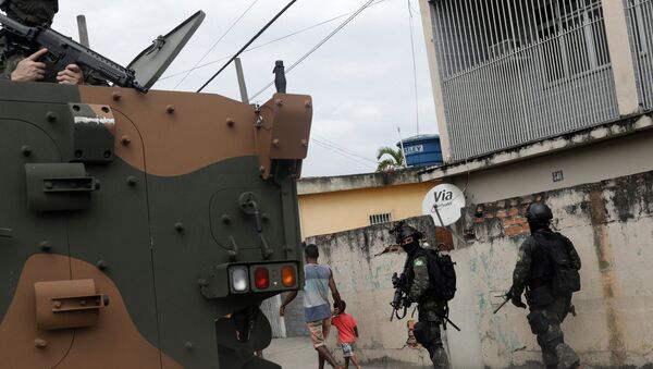 Armed forces members patrol during an operation against drug dealers in Coreia slum, in Rio de Janeiro, Brazil - Sputnik International