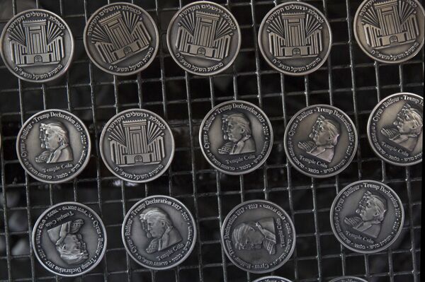 Coins bearing the images of President Donald Trump and King Cyrus, to honor Trump's recognition of Jerusalem as Israel's capital, are laid out at a private minting facility, in Tel Aviv, Israel, Wednesday, Feb. 28, 2018. Coins bearing the images of President Donald Trump and King Cyrus, to honor Trump's recognition of Jerusalem as Israel's capital, are laid out at a private minting facility, in Tel Aviv, Israel, Wednesday, Feb. 28, 2018. - Sputnik International
