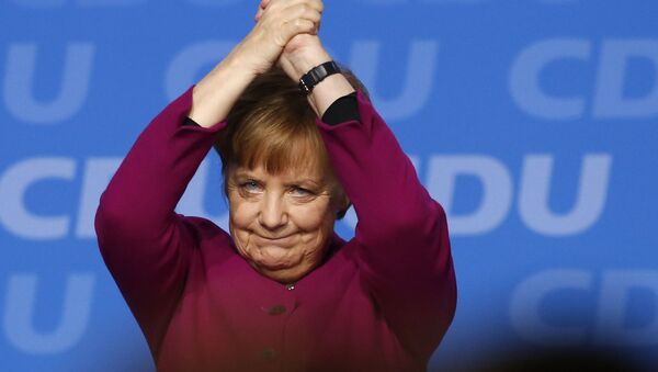 German Chancellor and party chairwoman Angela Merkel acknowledges the applause of the delegates after her speech during the party convention of the Christian Democratic Union CDU in Berlin, Germany, Monday, Feb. 26, 2018 - Sputnik International