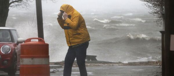 A pedestrian walks near the coastline Friday, March 2, 2018, in Newburyport, Mass. as a major nor'easter pounds the East Coast, packing heavy rain, intermittent snow and strong winds. A pedestrian walks near the coastline Friday, March 2, 2018, in Newburyport, Mass. as a major nor'easter pounds the East Coast, packing heavy rain, intermittent snow and strong winds. - Sputnik International