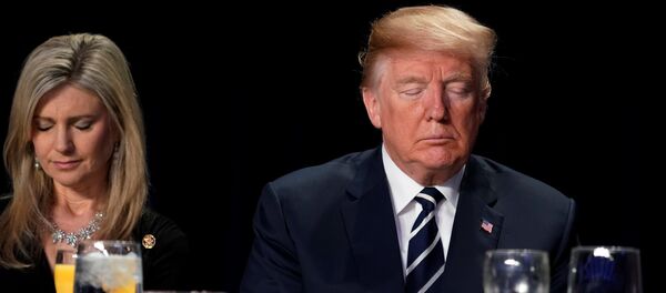 U.S. President Donald Trump (R) bows his head in prayer during the National Prayer Breakfast in Washington, U.S. February 8, 2018 U.S. President Donald Trump (R) bows his head in prayer during the National Prayer Breakfast in Washington, U.S. February 8, 2018 - Sputnik International