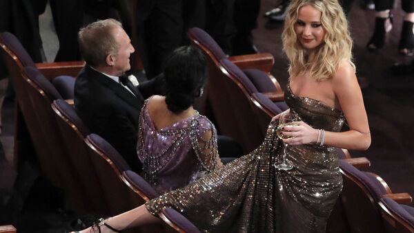 90th Academy Awards - Oscars Show - Hollywood, California, U.S., 04/03/2018 - (L-R) Salma Hayek and her husband Francois-Henri Pinault sit as Jennifer Lawrence stands - Sputnik International